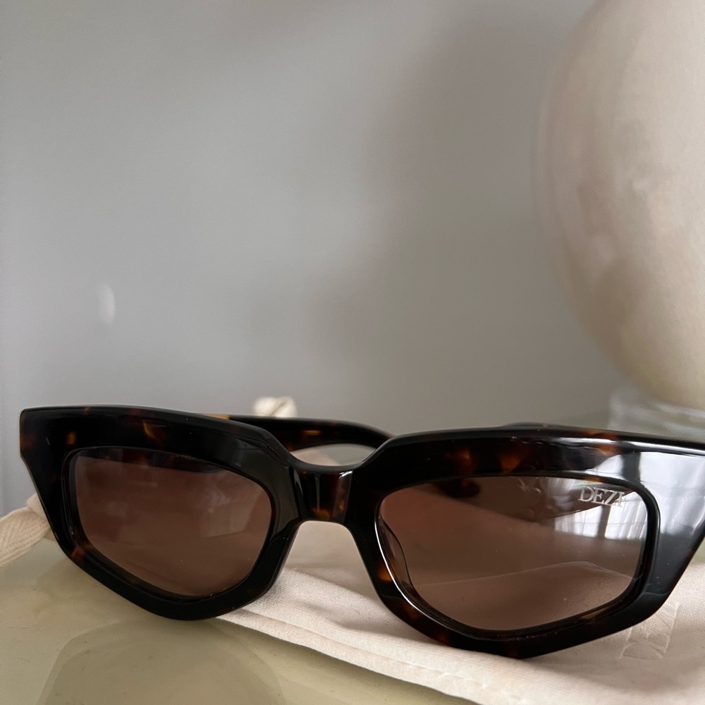 Dezi on read sunglasses